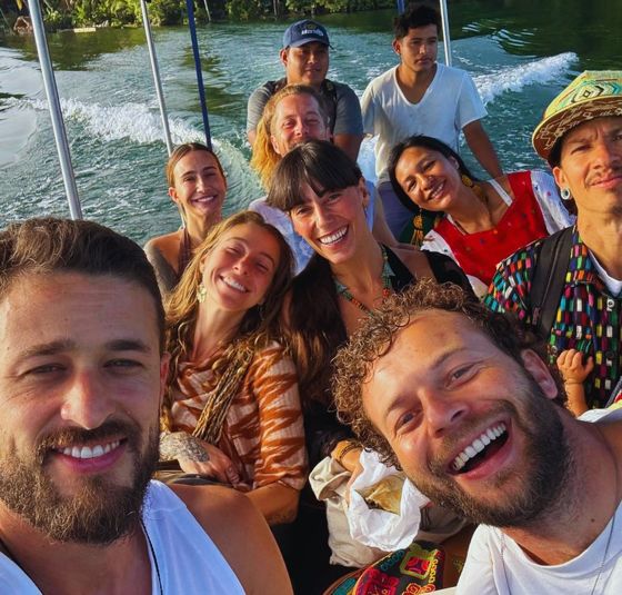The group on a boat crossing the lake