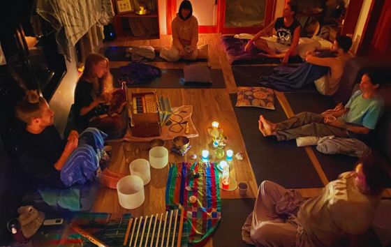 A sound healing circle by candlelight
