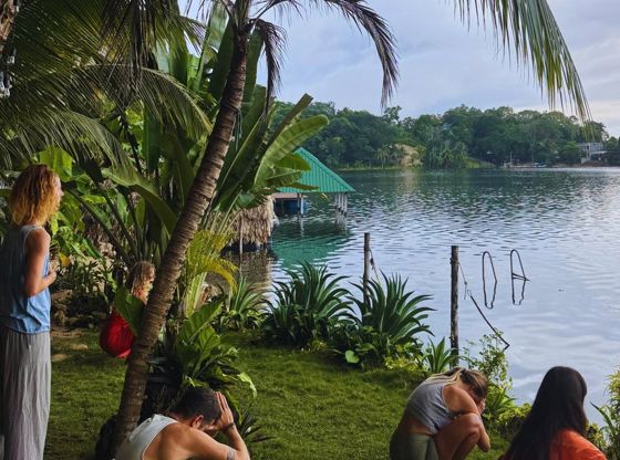 Sunrise practice on the grass beside Lake Petén Itzá